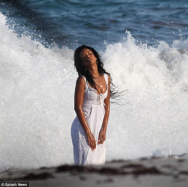 What, no bikini? Caribbean cutie Rihanna bathes in a sundress as she becomes the official face of Barbados